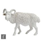 An early 20th Century German blanc de chine model of a goat, unmarked, length 24cm, restored.