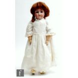 A Simon & Halbig bisque socket head doll sleeping brown eyes, open mouth with teeth, painted