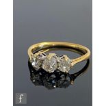 A mid 20th Century 18ct diamond three stone ring, old cut, claw set stones, total weight