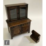 A 20th Century apprentice stained beech glazed dresser fitted with two drawers and cupboards below a