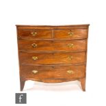 A George III mahogany bow front chest of two short and three long drawers, later brass fret drop