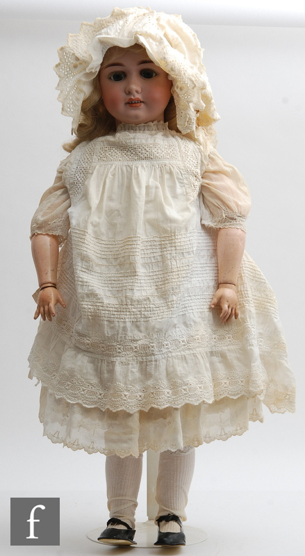 A Gerbruder Kuhnlenz bisque socket head doll, head mould 54, with sleeping blue eyes, open mouth