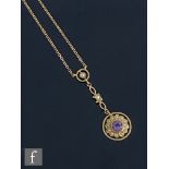 A 14ct Edwardian style amethyst and seed pearl pendent, central amethyst within a pear set border,