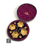 A cased set of four hallmarked silver open salts with gilt bowls and conforming spoons,