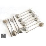 Eight 19th Century Russian silver tea spoons, each with engraved initials within foliate