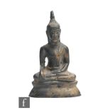 An 19th Century Sino-Tibetan bronze figure of shakyamuni buddha seated in Padmasana, hands cast in
