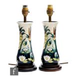 AMENDED DESCRIPTION A pair of Moorcroft Pottery table lamps decorated in the Lamia pattern