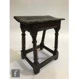 A late 17th to early 18th Century oak joint stool, moulded edge dished top over a plain frieze, on