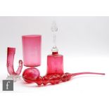 A collection of late 19th to early 20th Century cranberry glass wares to include a table bell,
