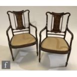 A pair of Edwardian mahogany salon open armchairs with ivory and satinwood inlay, detailed with