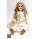 An early 20th Century SFBJ bisque socket head doll, head mould 301, with sleeping blue eyes (eyelids