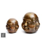 Two Chinese/Tibetan bronze cast 'Four faces of Buddha' lucky figures, each of cast with four