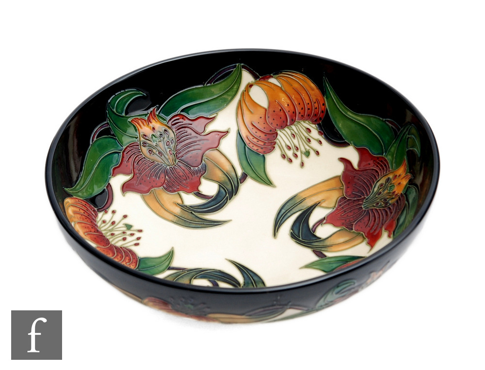 A large Moorcroft Pottery bowl decorated in the Anna Lily pattern designed by Nicola Slaney,