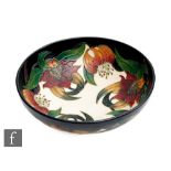 A large Moorcroft Pottery bowl decorated in the Anna Lily pattern designed by Nicola Slaney,