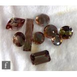 Nine natural loose andalusite stones to include round faceted and emerald cut examples, total weight