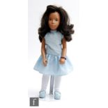 A Trendon Sasha 113 Brunette Dancing Dress doll, wearing original blue dress, and incorrect white