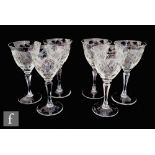 A set of six 20th Century clear crystal wine glasses, the round funnel bowl decorated with