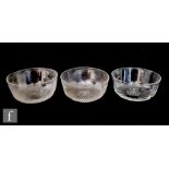 A set of three late 19th to early 20th Century clear crystal finger bowls of circular form with