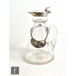 An early 20th Century hallmarked silver and clear glass noggin, conical glass body below silver