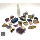 A large collection of amethyst and natural rock specimens, geodes, pyrites and crystals contained in