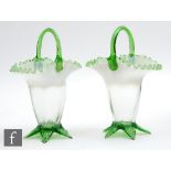A pair of late 19th Century posy baskets of flared form with a tight frilled rim and arched