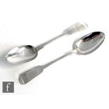 A pair of hallmarked silver fiddle pattern serving spoons of plain form, weight 4oz, Newcastle 1849,