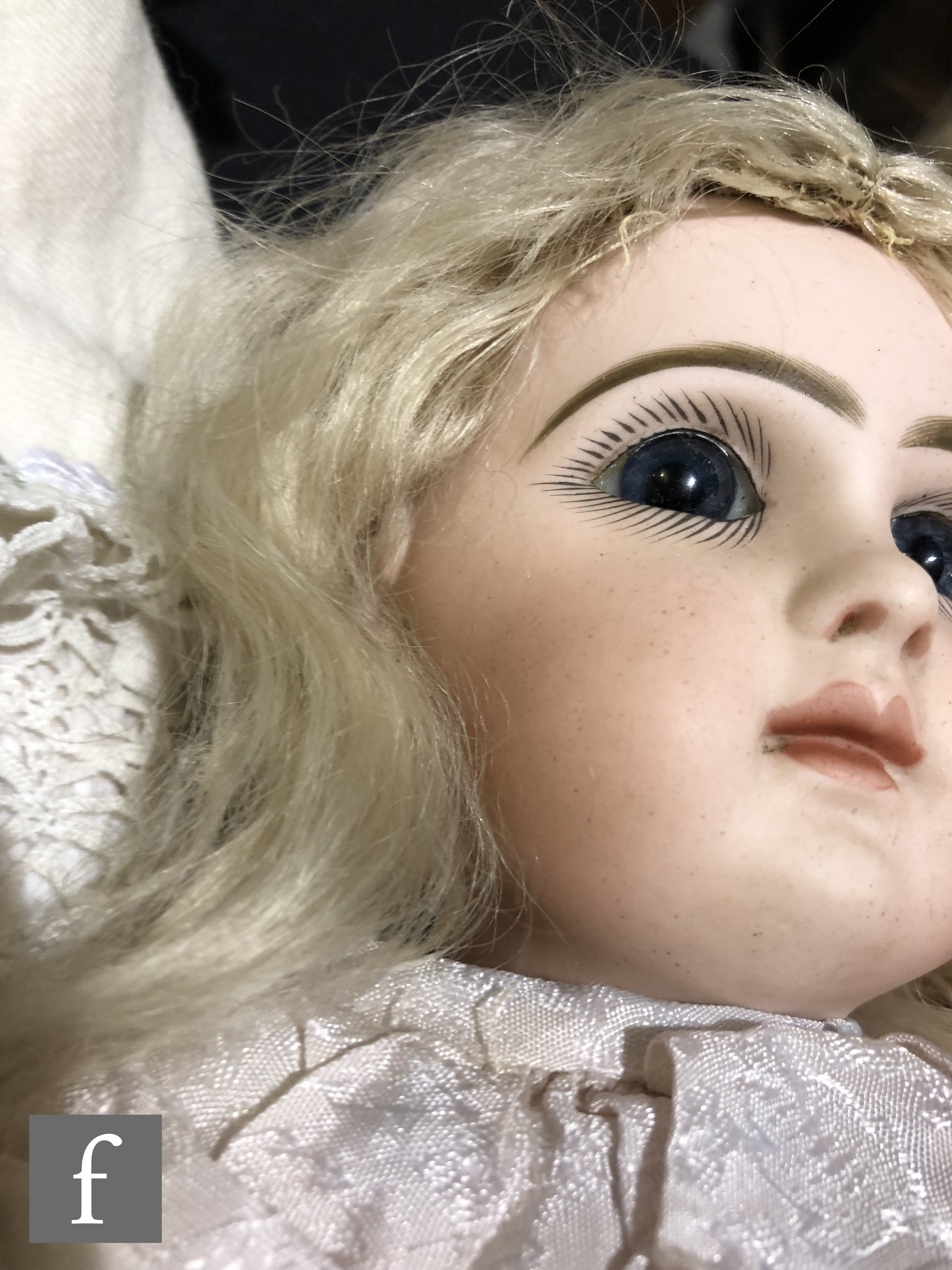 An unmarked French bisque head doll, probably Jumeau, with fixed blue paperweight eyes, painted - Image 4 of 7