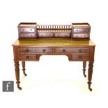 A late 19th to early 20th Century mahogany writing desk by Edwards and Roberts,