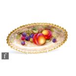 A Royal Worcester Fallen Fruits oval shaped dish decorated by Freeman with hand painted peaches