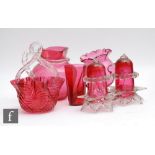 A small collection of late 19th Century cranberry glass to comprise a crackle glass jug with applied