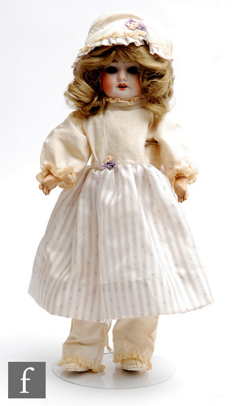 An early 20th Century SFBJ bisque socket head doll, head mould 60, with sleeping blue eyes, open