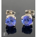 A pair of 14ct white gold tanzanite stud earrings, diameter of stone approximately 6mm.