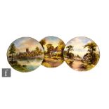 Three 1950s Royal Worcester cabinet or wall plates decorated with scenes of Worcester Cathedral,