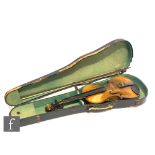 A 20th Century violin labelled Antonius Stradivarius Cremonensis, length 34cm, with a bow and