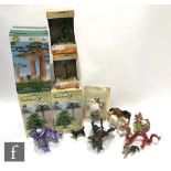 A collection of assorted plastic figures, to include mythical creatures and assorted animals,