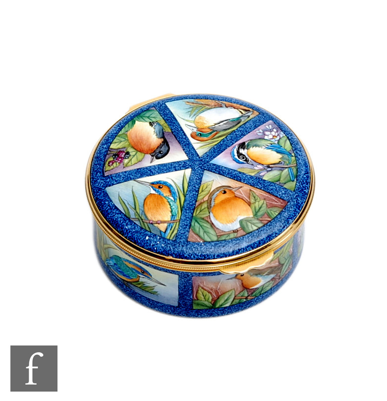 A Moorcroft Enamels circular trinket box decorated with hand painted British birds (robin,