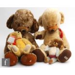 Two 1960s-1970s Merrythought Cheeky Bears, both with amber and black eyes and bells to ears, the