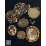 A Georgian memorial hair locket converted to a brooch, with a gilt metal mounted cameo brooch, a
