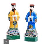 A pair of Chinese Republic period (1912-1949) porcelain high ranking Official figures, each in