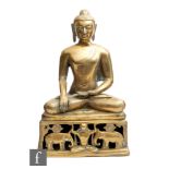 A 20th Century Tibetan Century cast polished metal figure of Buddha, seated in lotus position with