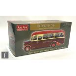 A Sun Star 5004 1:24 scale Bedford OB Duple Vista Coach in Hants & Sussex Motor Services red livery,