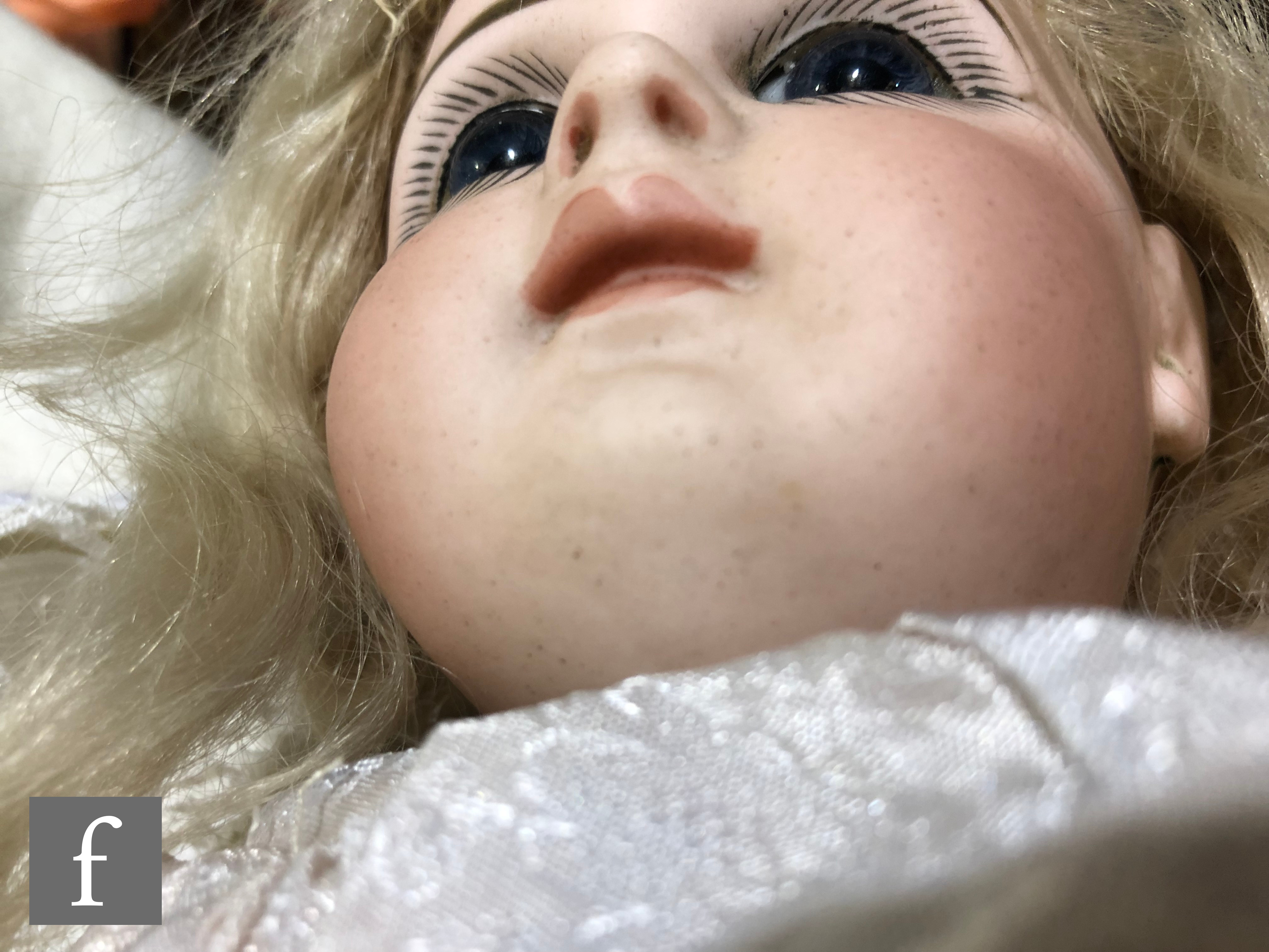 An unmarked French bisque head doll, probably Jumeau, with fixed blue paperweight eyes, painted - Image 6 of 7