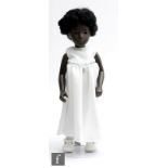 A Trendon Sasha Cora doll, wearing a handmade white dress decorated with a band of sequins, white