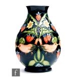 A Moorcroft Pottery baluster vase decorated in the Strawberry Thief pattern designed by Rachel