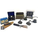 A collection of assorted collectables to include a 1930s toaster, a suede cased set of six travel