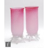 A pair of late 19th Century continental glass vases of sleeve form with diamond mould decoration