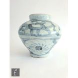 A Chinese Ming Dynasty Jar (1368-1644), of tapered ovoid form, the body loosely painted with lotus