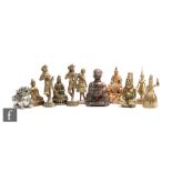 A collection of various Chinese and South-East Asian votive and decorative cast metal figures,