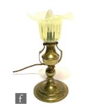 An Arts and Crafts brass gimbal light fitting, complete with a John Walsh Walsh straw opal glass