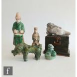 A collection of Chinese Ming Dynasty (1368-1644) pottery figures, to include a black glazed chest,